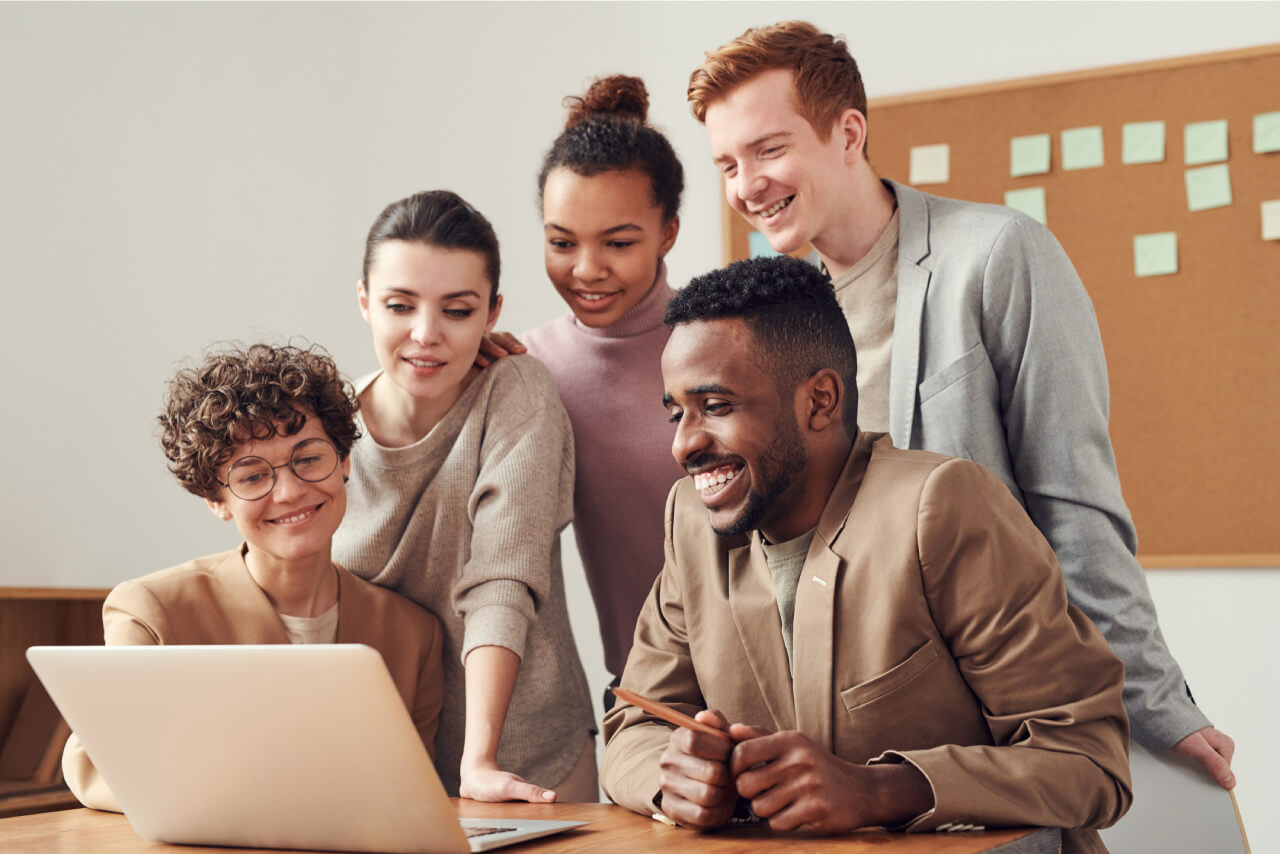 A project team working together at a laptop